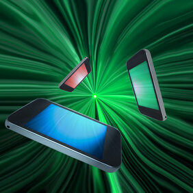 Three blank telecommunication devices with illuminated screens in a variety of colours giving the appearance of moving towards the centre of a green motion zoom effect against a black background.